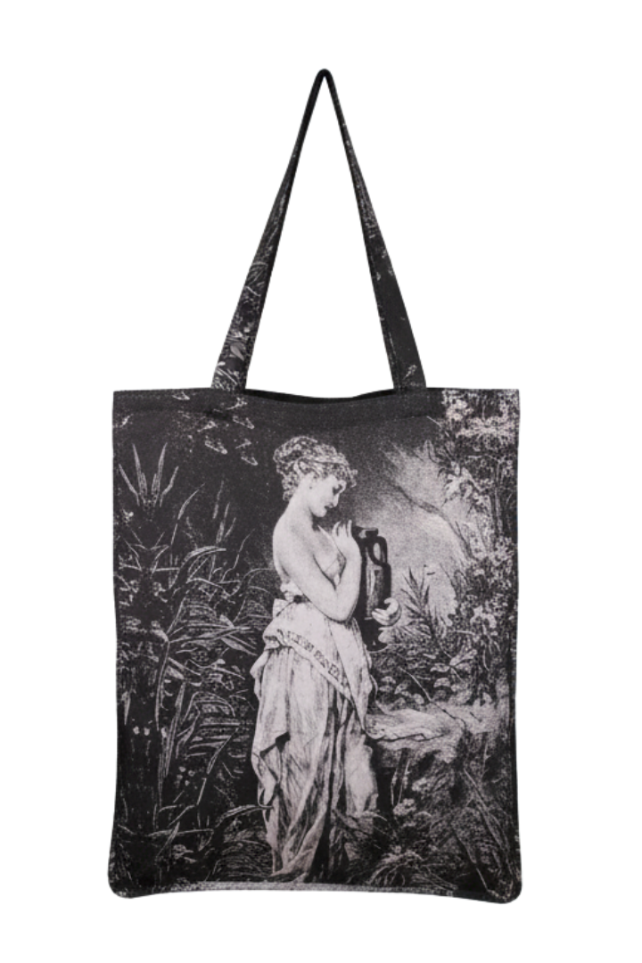 Front view of the Greek Tragedy Tote, featuring a black-and-white sublimated print of a classical female figure in a lush, natural setting.