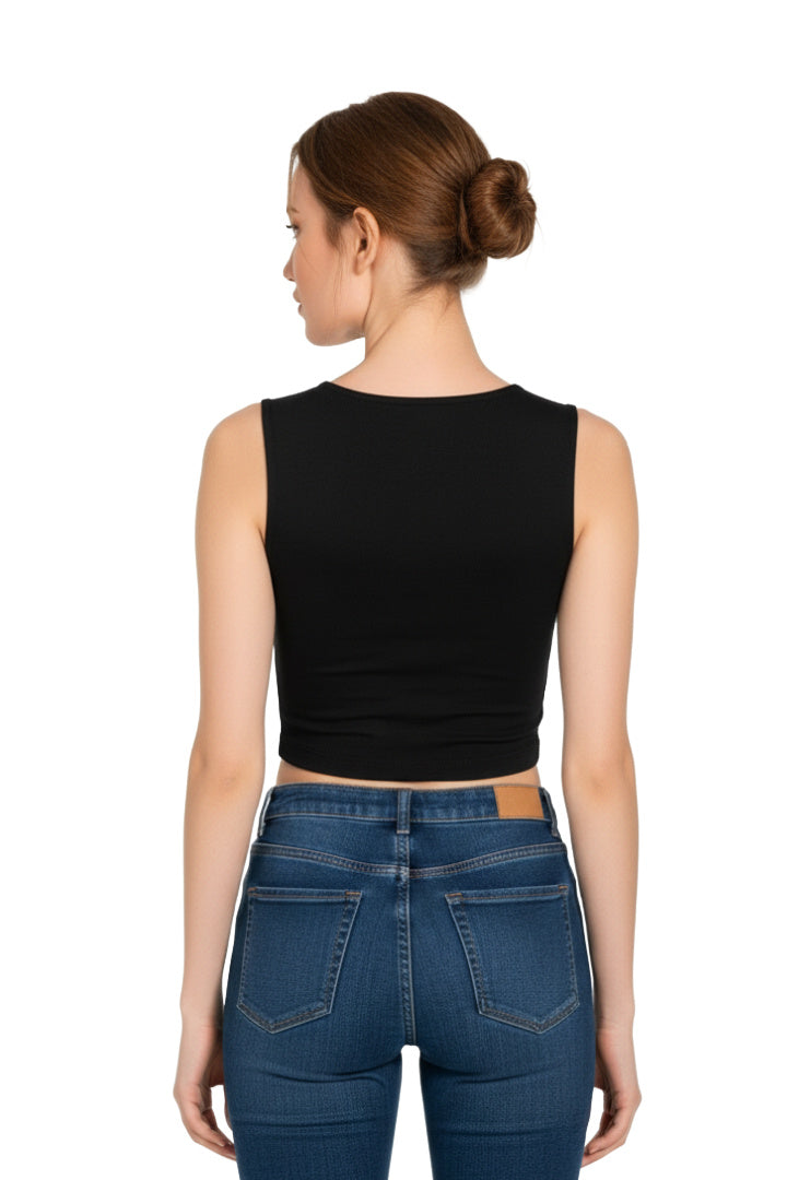 Back view of a woman wearing a black square neck crop top paired with high-waisted blue jeans.